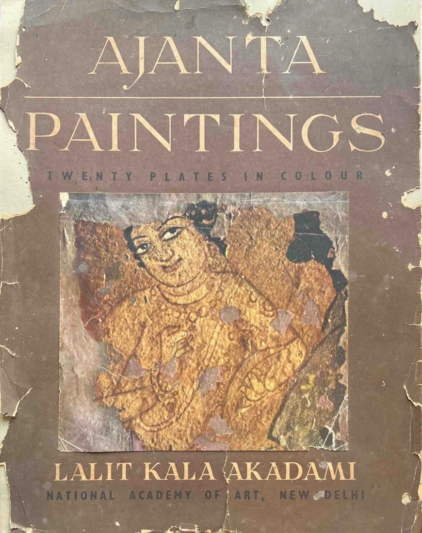 RARE 1956 EDITION -AJANTA PAINTINGS; PUBLISHED BY LALIT KALA AKADEMI, NEW DELHI: AJANTA PAINTINGS – TWENTY PLATES IN COLOUR A VINTAGE BOOK COVER FEATURING A REPRODUCTION OF AN ANCIENT AJANTA CAVE PAINTING, SHOWING A GRACEFUL FEMALE FIGURE RENDERED IN EARTHY OCHRES AND SOFT,