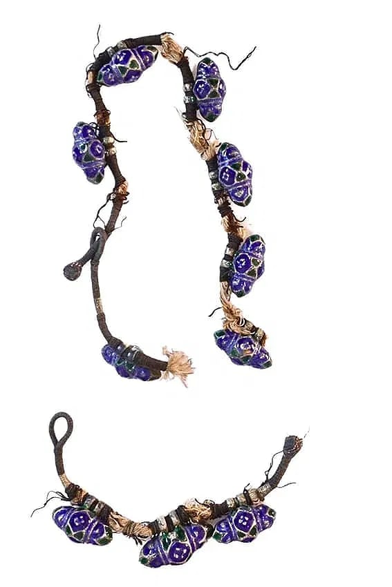 TEN ENAMELLED SILVER PENDANT BEADS, MULTAN, PUNJAB, INDIA (NOW PAKISTAN), LATE 19TH CENTURY: TEN ENAMELLED SILVER PENDANT BEADS, MULTAN, PUNJAB, INDIA (NOW PAKISTAN), LATE 19TH CENTURYEACH LOZENGE-SHAPED FORM WITH TWIN LOOPS ATTACHED TO A NOW FRAGMENTARY BAZUBAND AND NECKLACE STRING, THE