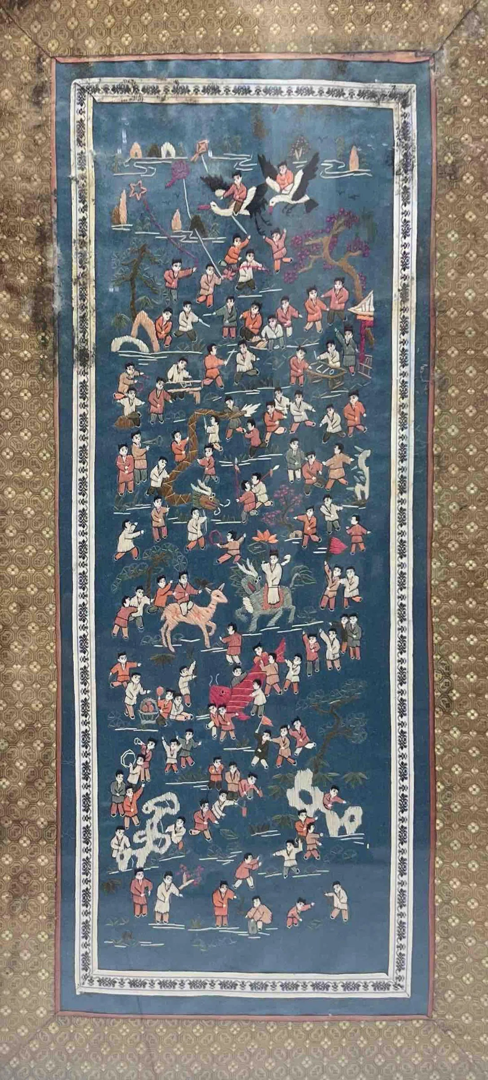 NARRATIVE FOLK PANEL OF MYTHOLOGICAL SCENES: NARRATIVE FOLK PANEL OF MYTHOLOGICAL SCENESTHIS VIBRANT, MULTI-FIGURED PANEL DEPICTS A SERIES OF FOLK AND MYTHOLOGICAL SCENES ARRANGED IN A VERTICAL STORYTELLING FORMAT. SET AGAINST A DEEP BLUE