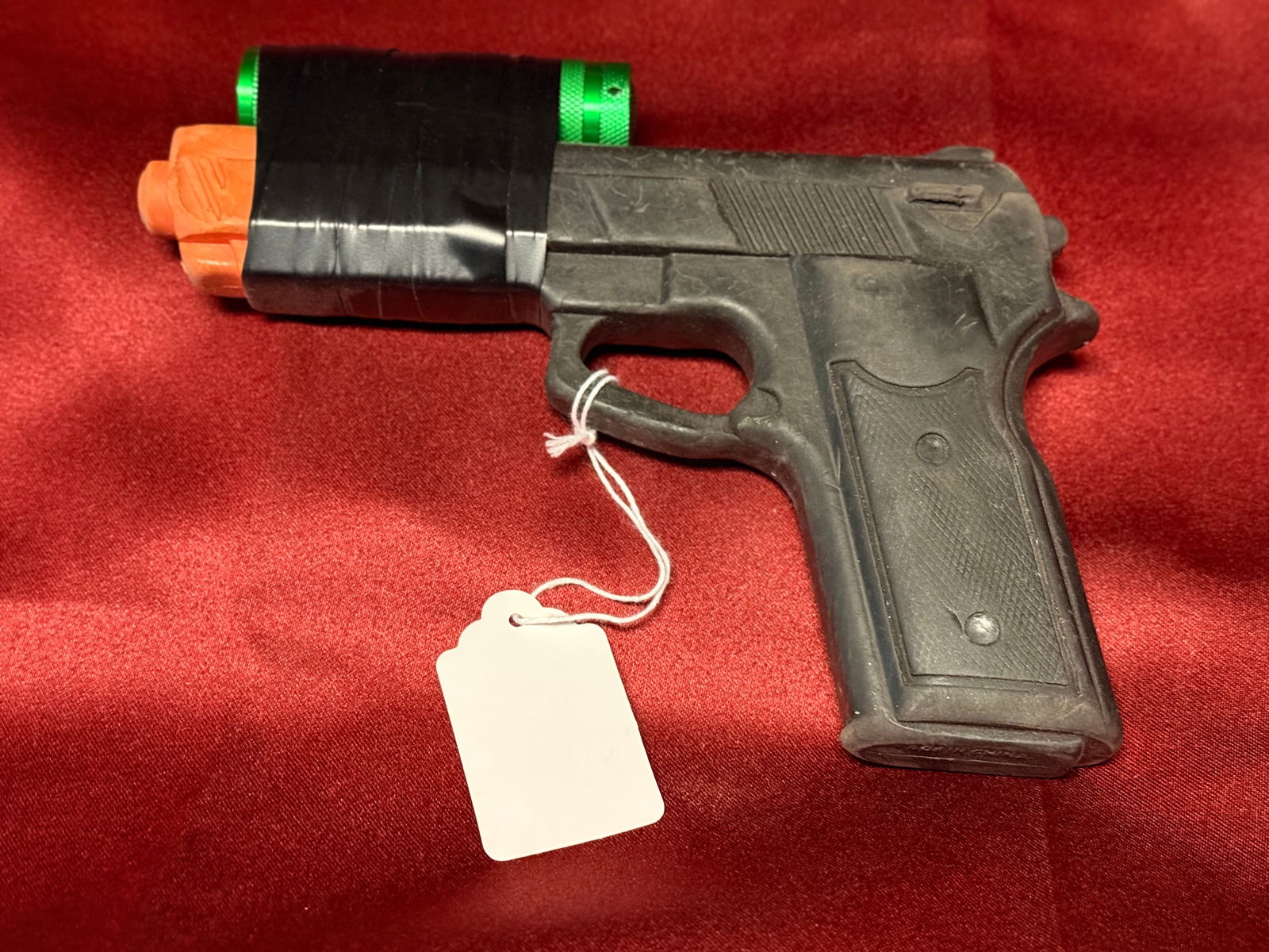 Solid rubber fake gun with light (green): Solid rubber fake gun with light (green) We encourage you to place your bids now as you never know what may come up to prevent bidding live.