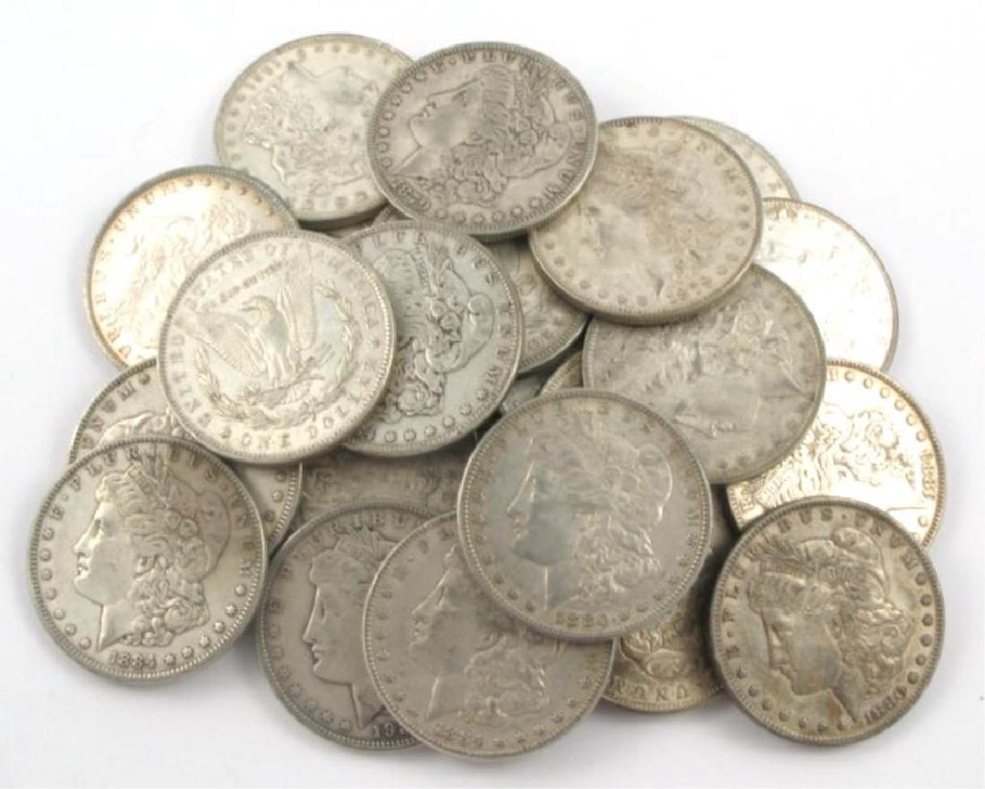 (20) F-XF Mixed Dates Morgan Silver Dollars: Item is as shown in image. Bidder is responsible for all value and grade determination based upon image. All bids constitute abinding contract and agreement to pay.