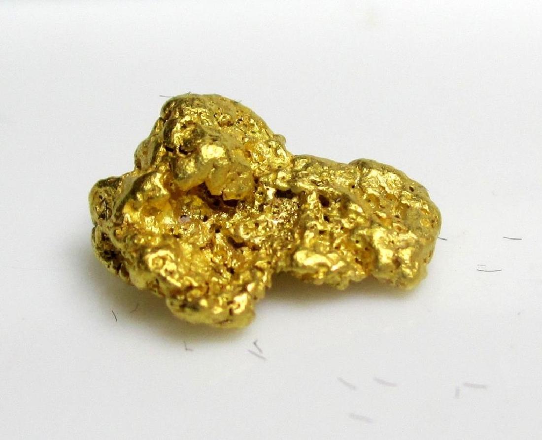 2.35 gram Natural Gold Nugget: Please note that all items are as shown in image. Bidder is responsible for all grade based upon images and value. Bidder further agrees to all terms and understands all nuances of bidder registration