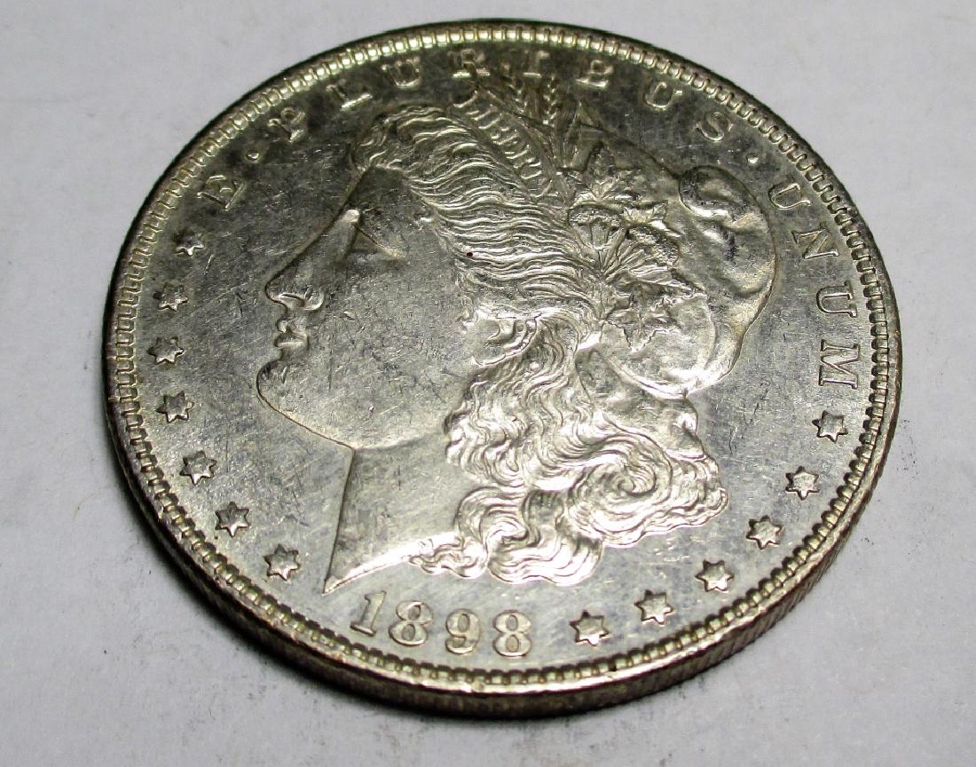 1898 P Morgan Silver Dollar: Please note that all items are as shown in image. Bidder is responsible for all grade based upon images and value. Bidder further agrees to all terms and understands all nuances of bidder registration