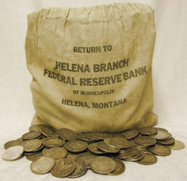 Lot of 70 Morgan Silver Dollars: A lot of 70 assorted grades, nints and dates on Morgan silver dollars, unsearched lot. g-au