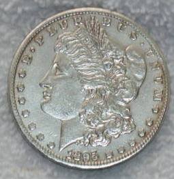 1895 Morgan Silver Dollar- Key Date-US FILE-myyu2: Designer: George T. Morgan Diameter: 38.1 millimeters- Metal Content:Silver - 90% Copper - 10%- Weight: 26.73 grams Edge: Reeded- Low mintage! 1895 Morgan silver dollar- probably cleaned- Est-250-450-