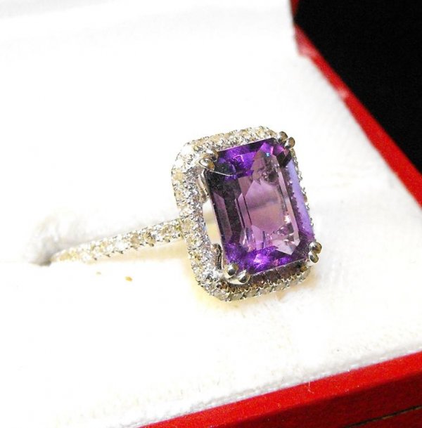 Fine 14k WG Amethyst and Diamond Ladies Ring: A very nice emerald cut amethyst approx 5 cts. with diamond accents. Very pretty mount.