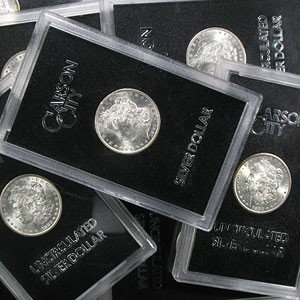 1880-1885 "CC" Morgan Dollar Set (6 coins), GSA: After lying unnoticed in a U.S. Treasury vault for over 60 years, a hoard of Uncirculated Carson City Morgan silver dollars was discovered during an inventory audit. The General Services Administratio