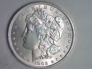 1902 O Morgan Silver Dollar: This coin is being sold to the highest bidder, with no grading specification, we have included high resolution stills of front and back for the bider to determine grade and value. The estimate is a re