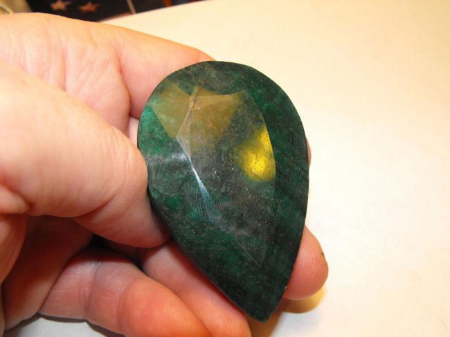 447 ct. Emerald Gemstone: This gem has been naturally mined from the earth. It is not a synthetic stone, it is areal mother nature made item. Any treatments are done so in accordance with the accepted practices within the indu