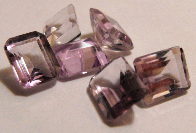 20 cts. Amethyst Gemstones: All of our evaluations use some or all of the following Gemological tools. : A fully corrected triplet loupe, binocular microscope, master color comparison diamond set, electronic carat balancing scal