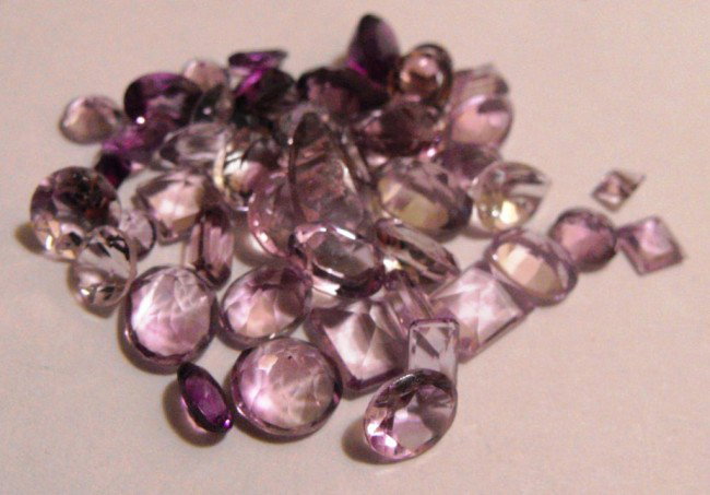 42.31 ct. Gemstone Parcel: All of our evaluations use some or all of the following Gemological tools. : A fully corrected triplet loupe, binocular microscope, master color comparison diamond set, electronic carat balancing scal