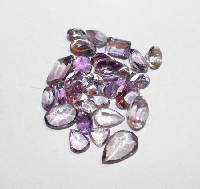 37.5 ct. Amethyst Gemstone Parcel: All of our evaluations use some or all of the following Gemological tools. : A fully corrected triplet loupe, binocular microscope, master color comparison diamond set, electronic carat balancing scal
