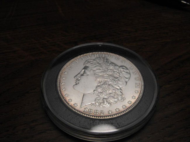 1882 P Morgan Silver Dollar: We offer at auction some of the best quality tangible assets. We strive to make your bidding experience the best on the net. Weekly sales of large bulk lots, individual lots and simply the most offeri
