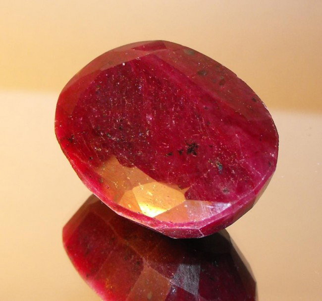 242 ct Ruby Oval - $ 14500 GG GIA: All of our evaluations use some or all of the following Gemological tools. : A fully corrected triplet loupe, binocular microscope, master color comparison diamond set, electronic carat balancing scal