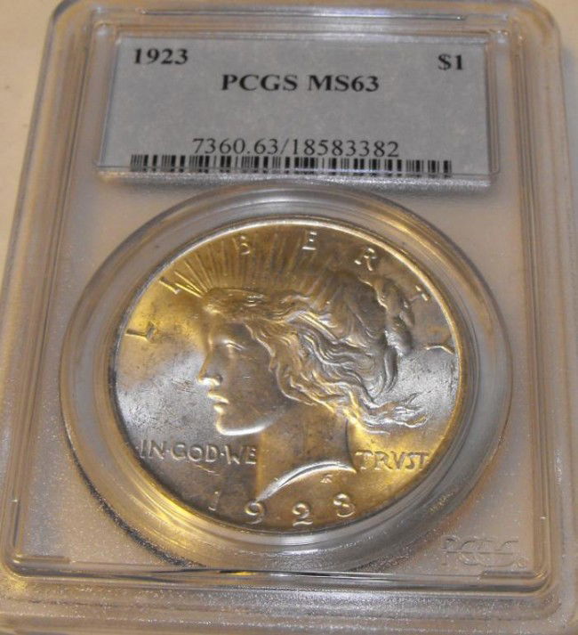 1923 PCGS MS 62 Peace dollar: This item has been placed into slab/holder/2x 2 by a third party prior to it being listed by us, we do not know the grades of the items.Evaluation should be based upon visual inspection via photo- Thi