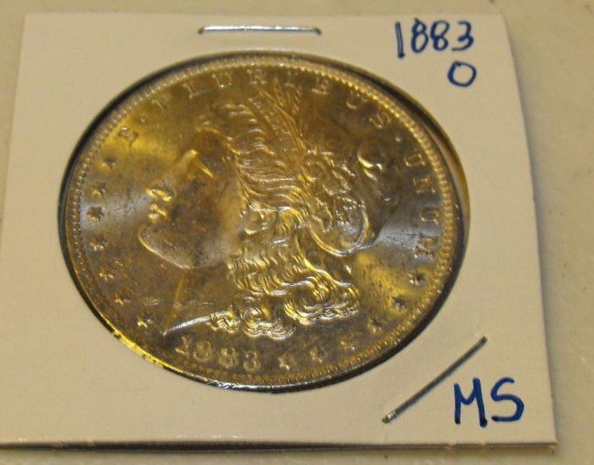 1883 O MS Morgan: This item has been placed into slab/holder/2x 2 by a third party prior to it being listed by us, we do not know the grades of the items.Evaluation should be based upon visual inspection via photo- Thi