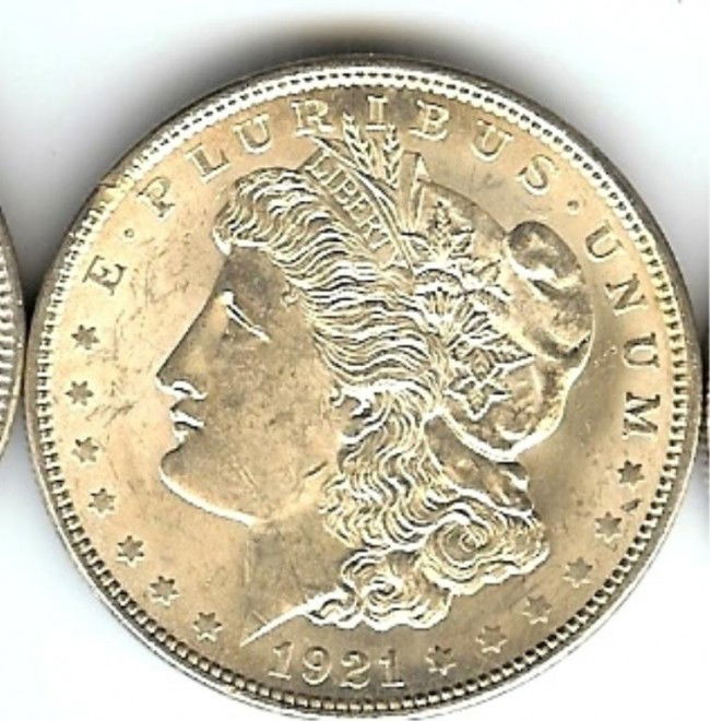 1921 Morgan Silver Dollar: This lot is as shown and graded by the previous owner, whether it is hand graded or by a recognized company. This is the exact item you will be sent.