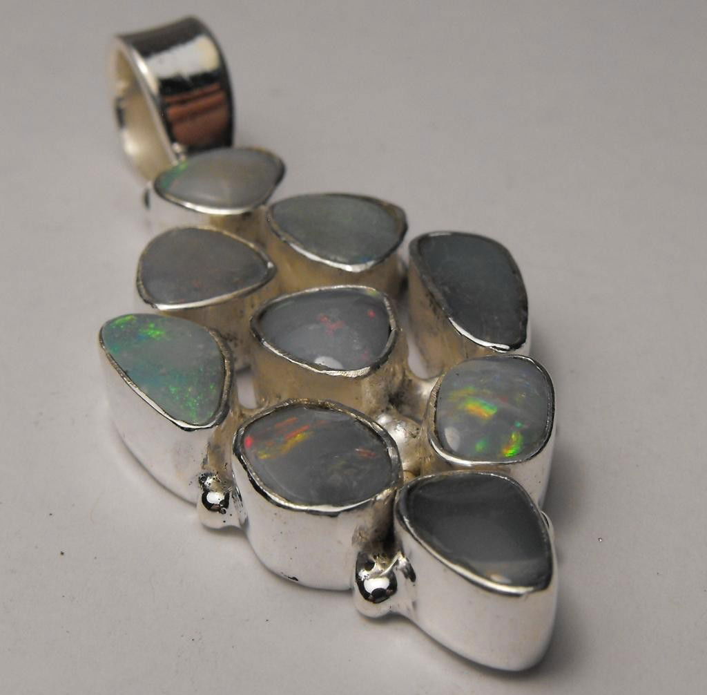 4.5 tcw Opal Pendant Sterling $ 375 GG GIA: This item was appraised with the gemstone in mount. Each gemstone has been evaluated on a case by case basis, some stones are higher quality than others and will be more valuable than larger stones of