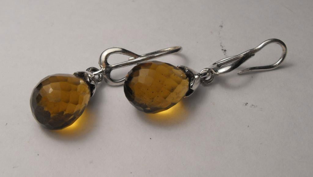 8.46 tcw Topaz E/R Brio's Silver - $ 780 GG GIA: This item was appraised with the gemstone in mount. Each gemstone has been evaluated on a case by case basis, some stones are higher quality than others and will be more valuable than larger stones of