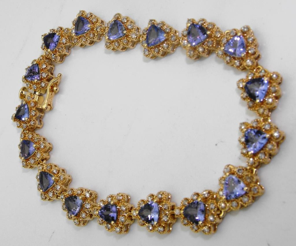 6.89 tcw Tanzanite Bracelet 1.60 tcw Dia $ 12.8K: A fancy filligree style setting bracelet. Having very clean tanzanite and diamnds adorning it, this is a sure fire investment quality item. Appraisal included.