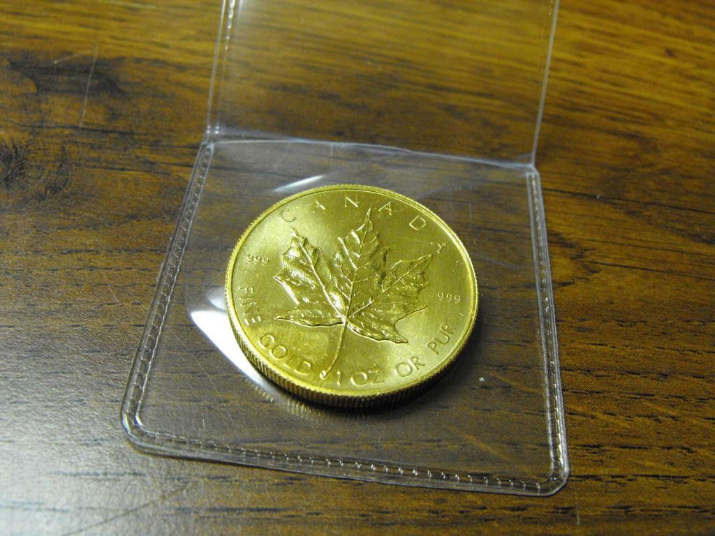 1 oz. Gold Bullion Maple Leaf - Random: We offer at auction some of the best quality tangible assets. We strive to make your bidding experience the best on the net. Weekly sales of large bulk lots, individual lots and simply the most offeri