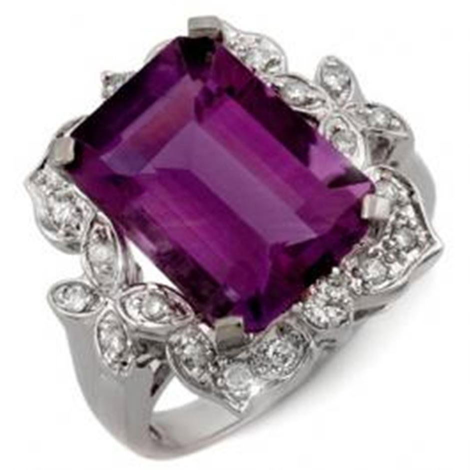 9.25 ctw Amethyst & Diamond Ring 14K: Diamond: 14 Round cut @ 0.25 ctw Clarity: SI-I Color: H-K Gemstone: Natural Amethyst Gemstone color: PurpleGemstone quality: Good-to-Very Good Gemstone Cut & Weight: 1 Emerald cut @ 9.0 ctw Metal Puri