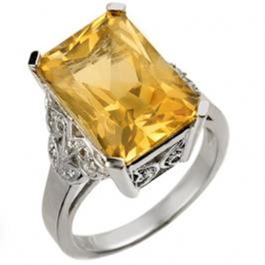 9.20 ctw Citrine & Diamond Ring 14K: Diamond: 14 Round cut @ 0.20 ctw Clarity: SI-I Color: H-K Gemstone: Natural Citrine Gemstone color: OrangeGemstone quality: Good-to-Very Good Gemstone Cut & Weight: 1 Emerald cut @ 9.0 ctw Metal Purit