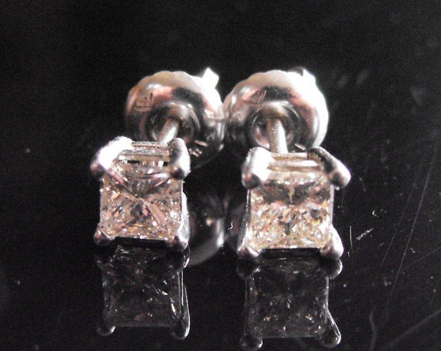 RA-.66 Princess Cut Diamond Earrings 14k: Diamond stud earrings; mounted in 14k white gold, set with diamonds weighing 0.66 ct. $1748 MSRP