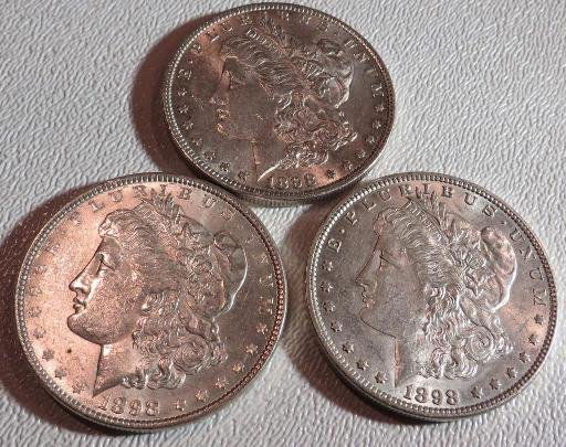 (3) 1898 P HIGH GRADE MORGAN DOLLARS: This lot of from a long time hoard of a Pacific Northwest Investor. These coins have been out of the market for a number of years. You are buying the exact lot in the photo. ALL SALES ARE FINAL.