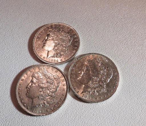 1883 o 1884 o 1898 p High Grade Morgan Dollars: This lot of from a long time hoard of a Pacific Northwest Investor. These coins have been out of the market for a number of years. You are buying the exact lot in the photo. USE YOUR JUDGEMENT TO EXAC