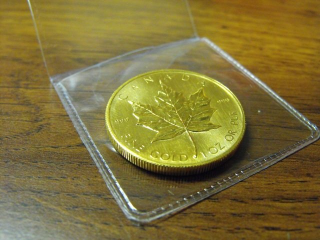 A 1 oz. Gold Maple Leaf Bullion: A 1 oz. Gold Canadian Maple Leaf Bullion Coin Random Date