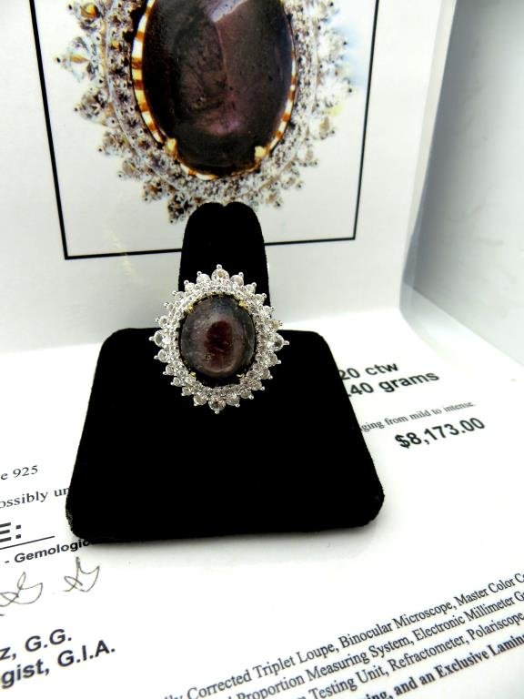 J-26 $ 8,173 App. Ruby & Sapphire Ring: 16.96 ct Un heated ruby with 2.24 tcw white sapphire ring is sterling silver with gold overlay.