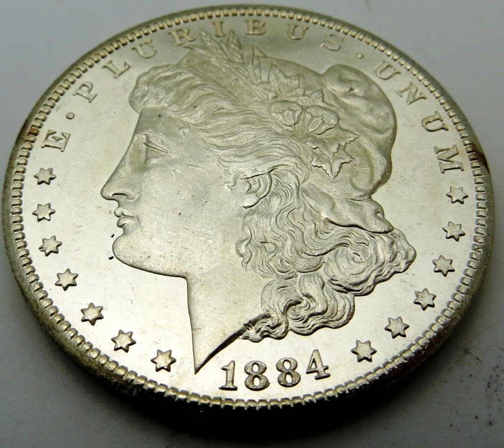 1884 CC Key Date Morgan Dollar CH BU: The item has been shown in a high resolution scan, unenhanced so you can make a educated appraisal for yourself. You as the bidder are responsibe for all value and grades.