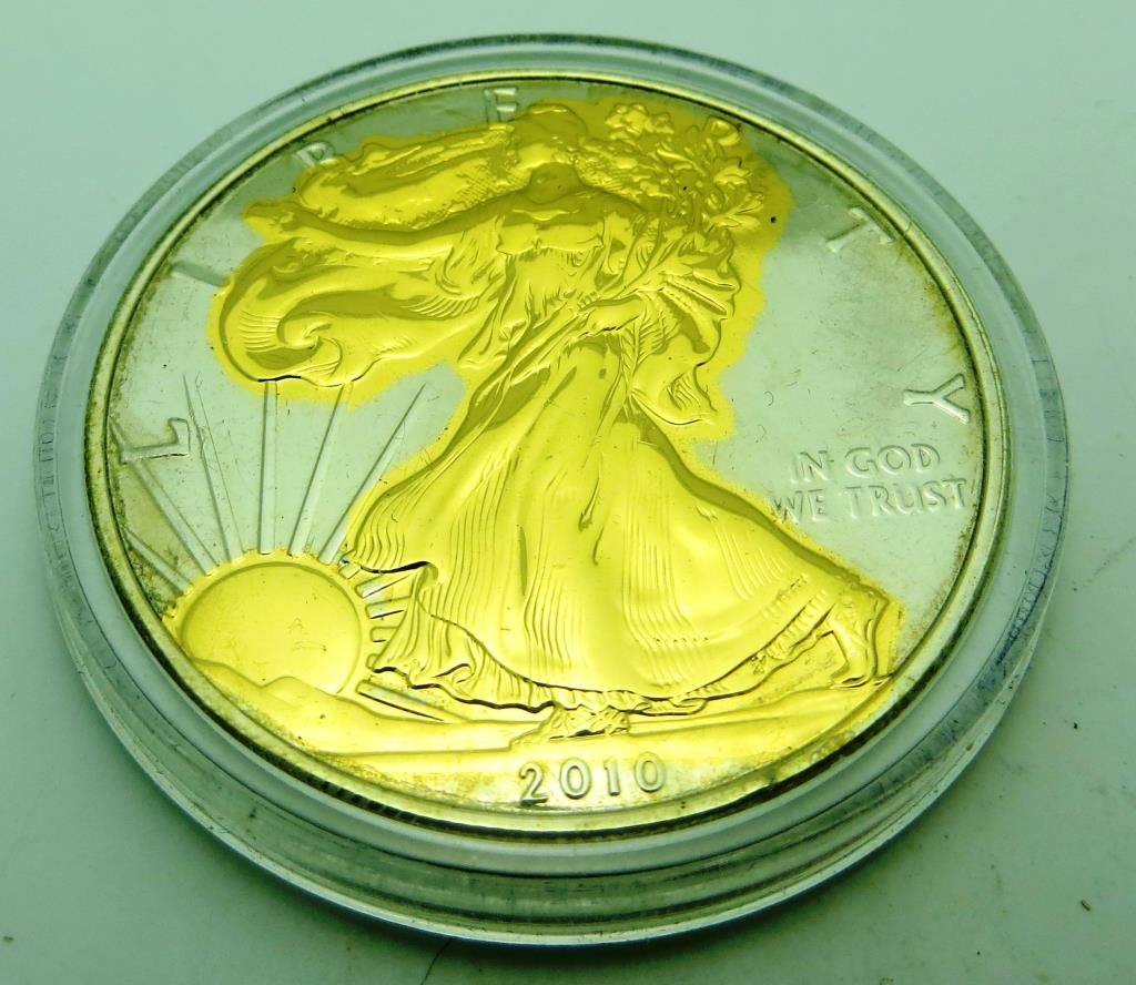 2010 US Silver Eagle Gold Overlay: The item has been shown in a high resolution scan, unenhanced so you can make a educated appraisal for yourself. You as the bidder are responsibe for all value and grades.