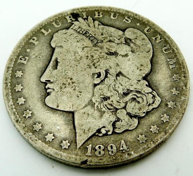 1894 O KEY Date Morgan Dollar: The item has been shown in a high resolution scan, unenhanced so you can make a educated appraisal for yourself. You as the bidder are responsibe for all value and grades.