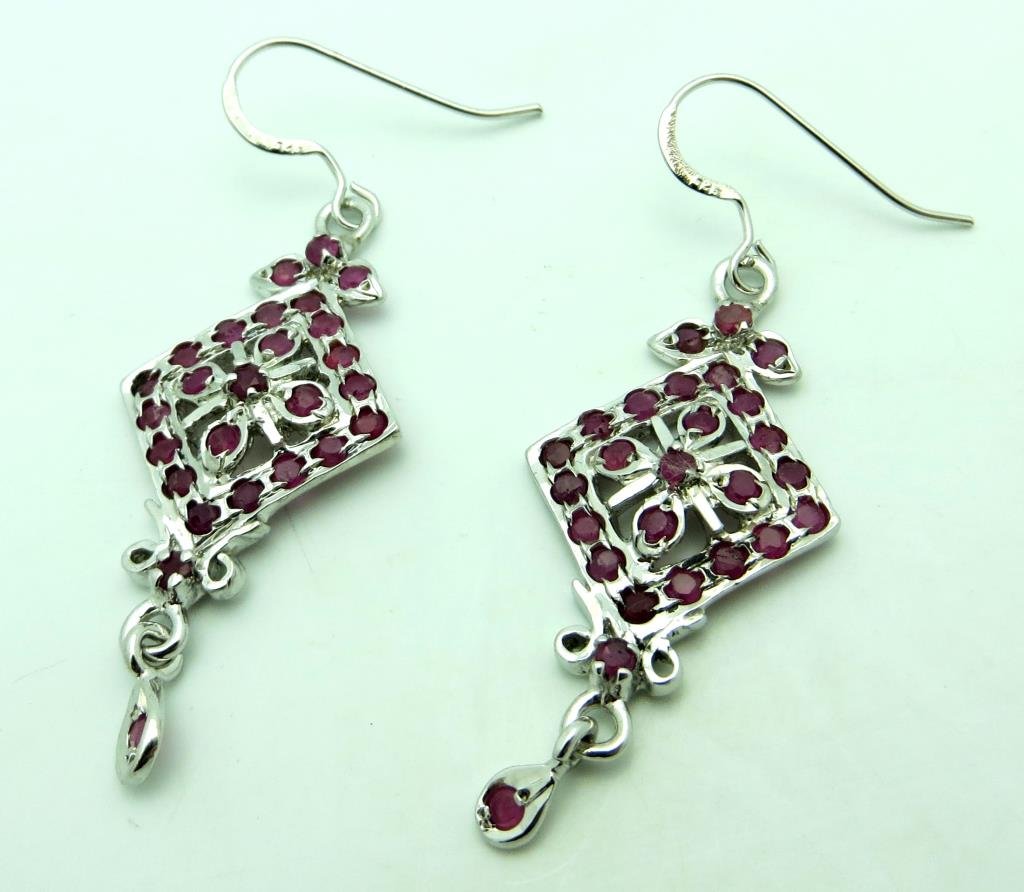 5.5 tcw Ruby & Sterling Dangler Earrings: The item is the exact item shown in photograph. Bidder is responsible for any and all valuation and all bids are binding, please review the terms prior to bidding.