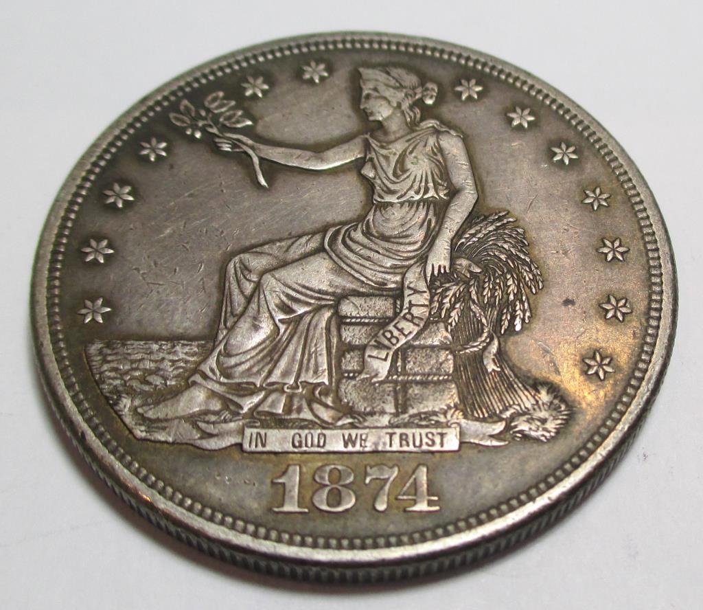 1874 S US Trade Dollar - AU w/ Mint Luster: Item is the item in the image. Bueyr is responsible for all value and grading. Any bid is acceptance of these terms, and all other terms agreed to when registering for auction.