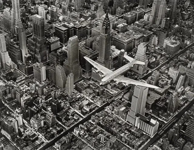 MARGARET BOURKE WHITE"DC-4 in Flight Over Manhatten": MARGARET BOURKE WHITE"DC-4 in Flight Over Manhatten" , Measures Approx 9.50 X 7.50 Inches, Unknown printing date.