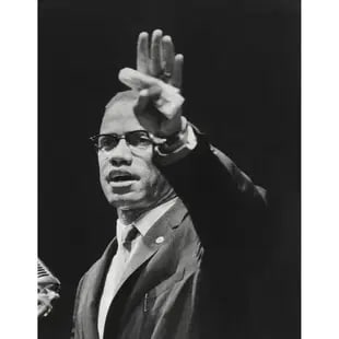 Gordan Parks - "Malcolm X, Muslim Newspaper, 1963" Photo Print: Gordan Parks - "Malcolm X, Muslim Newspaper, 1963" Photo Print - Mounted to Archival Quality Paper, Measures: 8.75 X 6.00 Inches. Unknown Print Date