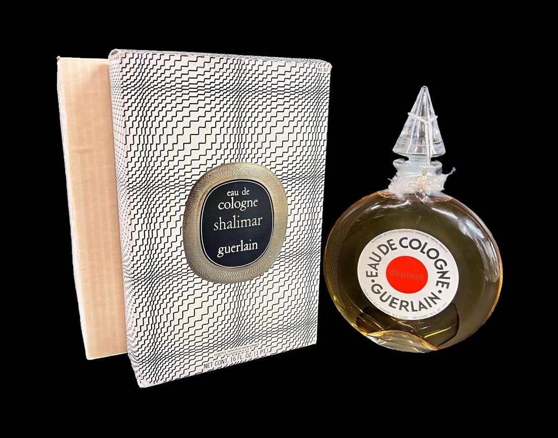 Factice Display Guerlain Shalimar Eau de Cologne In Box 16oz: Factice Display Guerlain Shalimar Eau de Cologne In Box. An oversized perfume bottle made by the manufacturer to be used for display and advertising purposes. Sealed bottle, with original box. c1960.