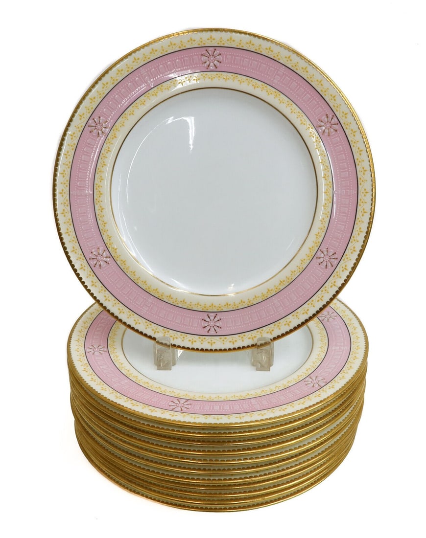 12 Coalport England for Tiffany & Co. Porcelain and Enamel Dinner Plates c1900: 12 Coalport England for Tiffany & Co. porcelain and enamel dinner plates, circa 1900. A pale pink and white ground to rim with gilt and white enamel floral and geometric designs to rim. Coalport Engla