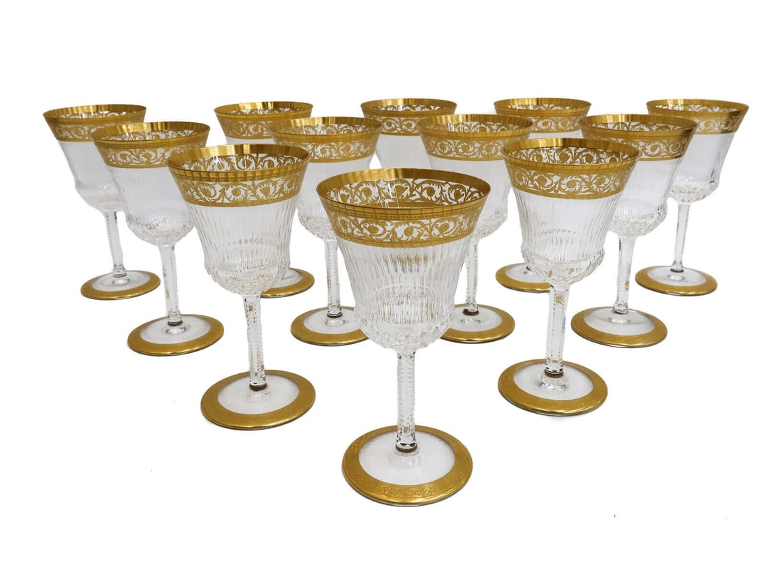 12 Saint (St) Louis France Cut Glass Burgundy Wine Goblets in Gold Thistle: 12 Saint (St) Louis France cut glass Burgundy Wine goblets in Gold Thistle. Gold encrusted notched foliate scrolls with cut multi-sided exterior. Acid etched St. Louis mark to the underside. Weight: A