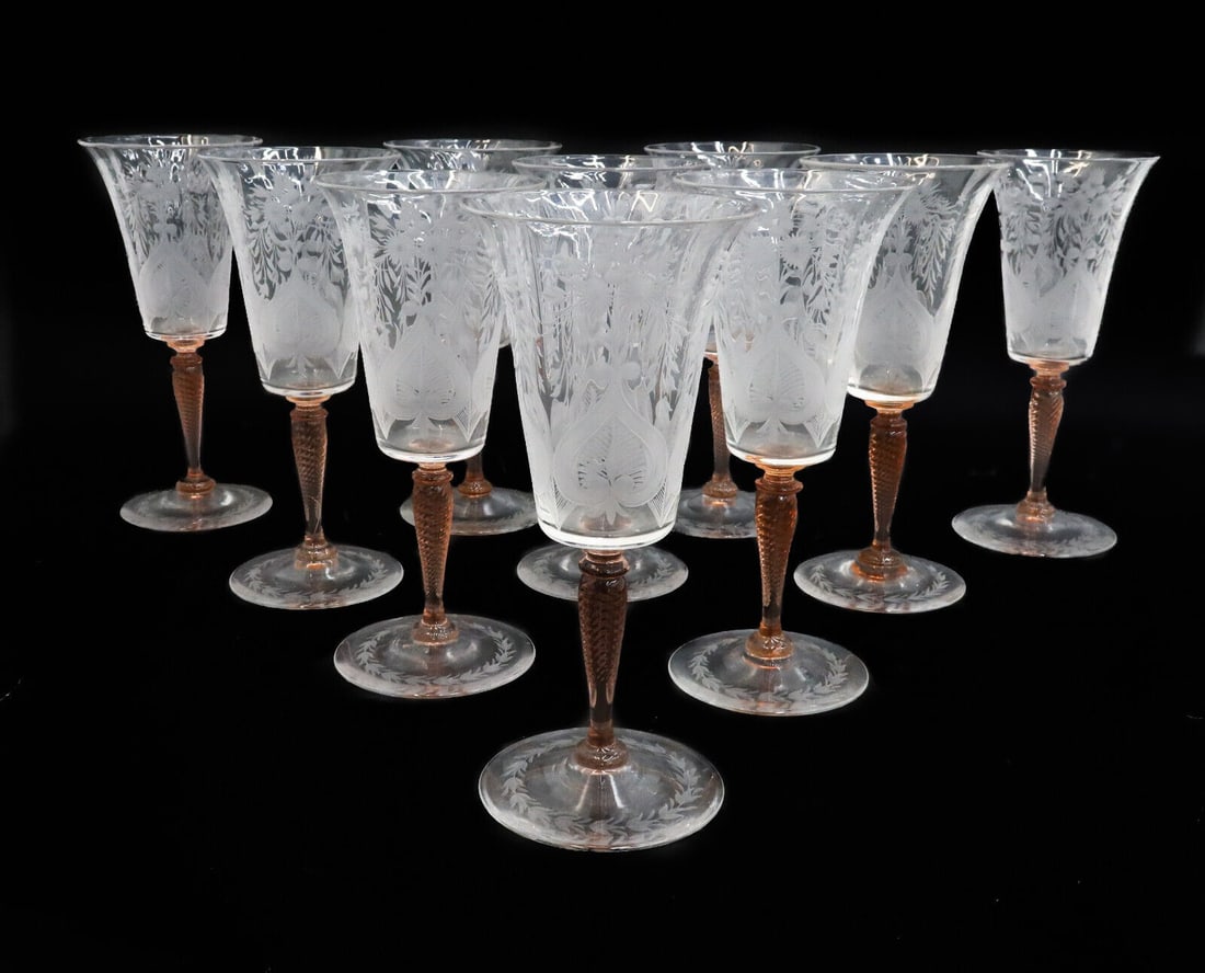10 Steuben Acid Etched Glass Red Wine Goblets in Van Dyke Leaves and Flowers: 10 Steuben acid etched glass red wine goblets in Van Dyke. Coral orange twisted stems with acid etched leaves and flowers to bowl and round base. Acid etched Steuben mark to pontil underside. Weight: 
