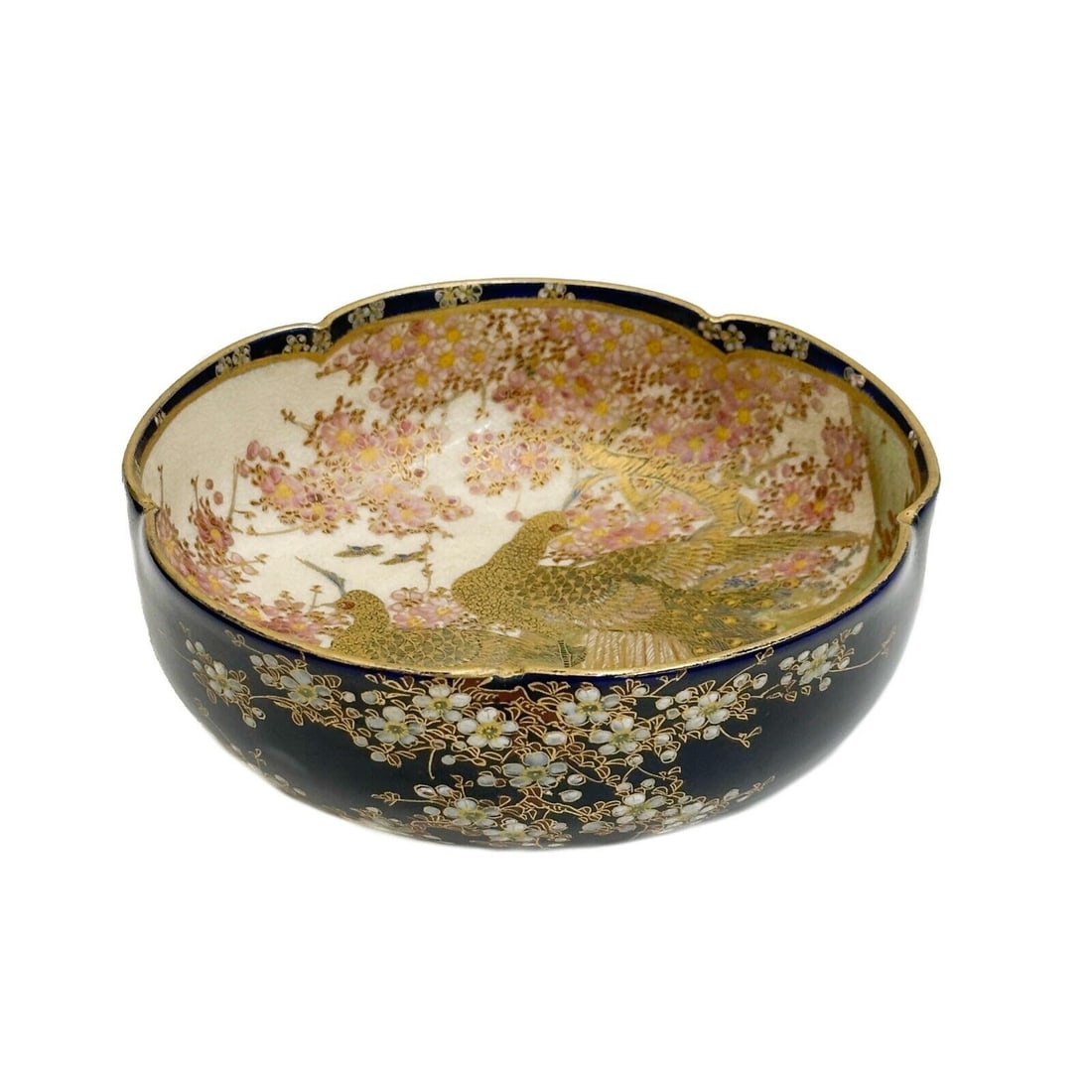 Koshida Japanese Satsuma Hand Painted Porcelain Bowl Peacocks Meiji period: Koshida Japanese Satsuma Hand Painted Porcelain Bowl, Meiji period. Lobed bowl, a cobalt blue ground to the exterior with cherry blossoms, decorated with a pair of peacocks to the interior, gilt accen