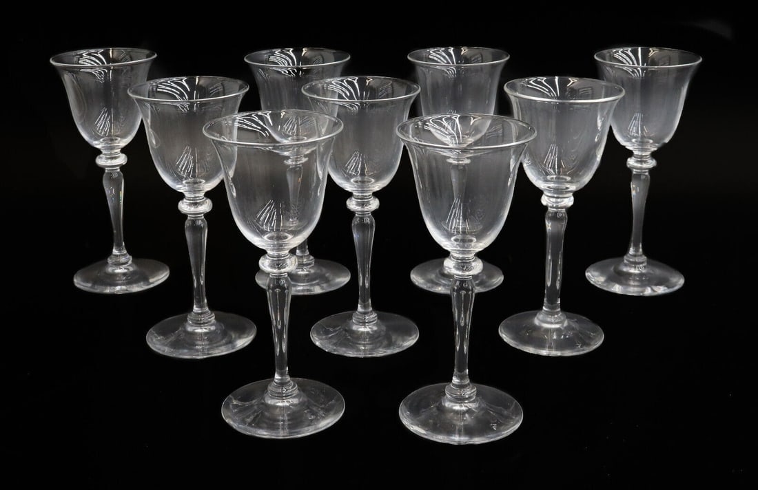 9 Steuben White Wine Goblets #6401 Signed Wafer Stem: 9 Steuben glass white wine goblets in #6401. Wafer stem. Signed "Steuben" to underside. Weight: Approx. 8 lbs Measurements: Approx. 3 inches diameter x 6.75 inches tall Condition: Great condition. No