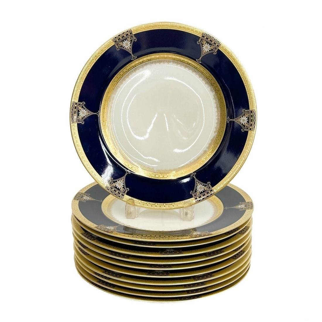 11 Pirkenhammer Czech Czechoslovakia Porcelain Dinner Plates circa 1920: 11 Pirkenhammer Czech Czechoslovakia Porcelain Dinner Plates, circa 1920. A blue ground to the edge, gilt decoration, white enamel flowers. Underside marked Pirkenhammer Czechoslovakia Weight: Approx.