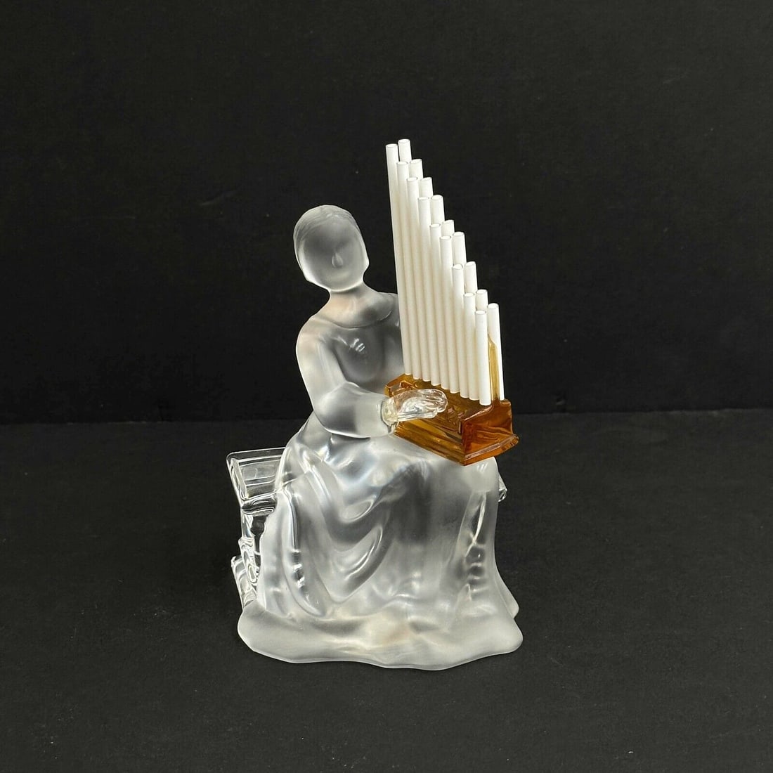 Saint St Louis France Crystal Art Glass Musician Figurine Pipe Organ Player: Saint St Louis France Art Glass Musician Figurine. Frosted glass figurine depicts a seated figure playing an amber colored glass pipe organ. Polished pontil to the underside, inscribed Saint LouisWeig