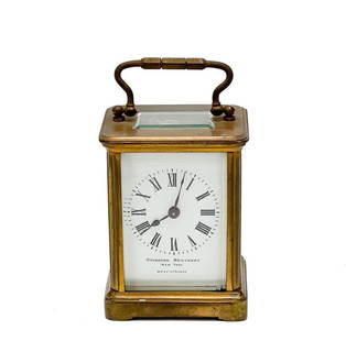 French Gilt Bronze & Glass Carriage Clock: French Gilt Bronze Carriage Clock for Ovington Brothers New York, circa 1910 . Gilt bronze carriage clock with carrying handle, glass panels to the sides. Clock face marked Ovington Brothers New York,