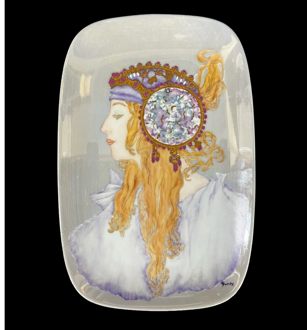 Hand painted porcelain portrait plate after Alphonse Mucha: Hand painted porcelain portrait plate after an Alphonse Mucha's art nouveau portrait, signed ?. ?????? (N. Voeskh), and initialed on reverse. Iridescent glaze. Measurements: Approx. 6.875 x 10.375 inc