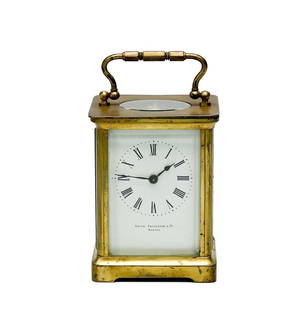 Smith Patterson & Co Boston Gilt Bronze & Glass Carriage Clock: Smith Patterson & Co Boston Gilt Bronze & Glass Carriage Clock. Carriage clock with carrying handle, glass panels to the sides. Face marked Smith Patterson & Co, back marked Made in France. Circa 1920